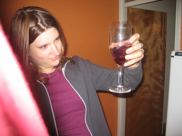 Alice looks suspiciously at her 'special' drink...