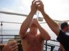 Angus having Ouzo poured down his throat...